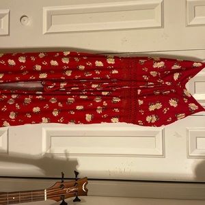 Casual red jumpsuit with shorts underneath